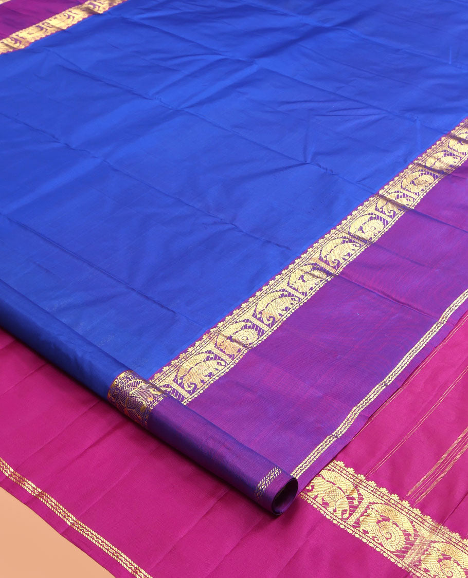 Royal Blue Plain Kanchipuram Silk Saree, a Contrast Rettai Pettu Border of Thazampoo Rekku, Banaras, Neli, Mayil, and Yaanai Designs , Zari Design Pallu, and a Contrast Blouse