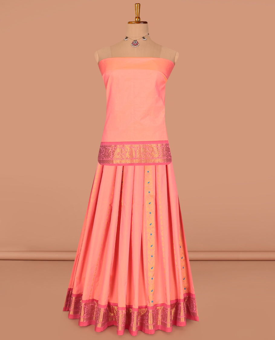 Peach Art Silk Pavadai Material Set, Decked Up with Zari Designs on Its Skirt, Complemented by a Contrast Traditional Zari Border, and a Matching Blouse
