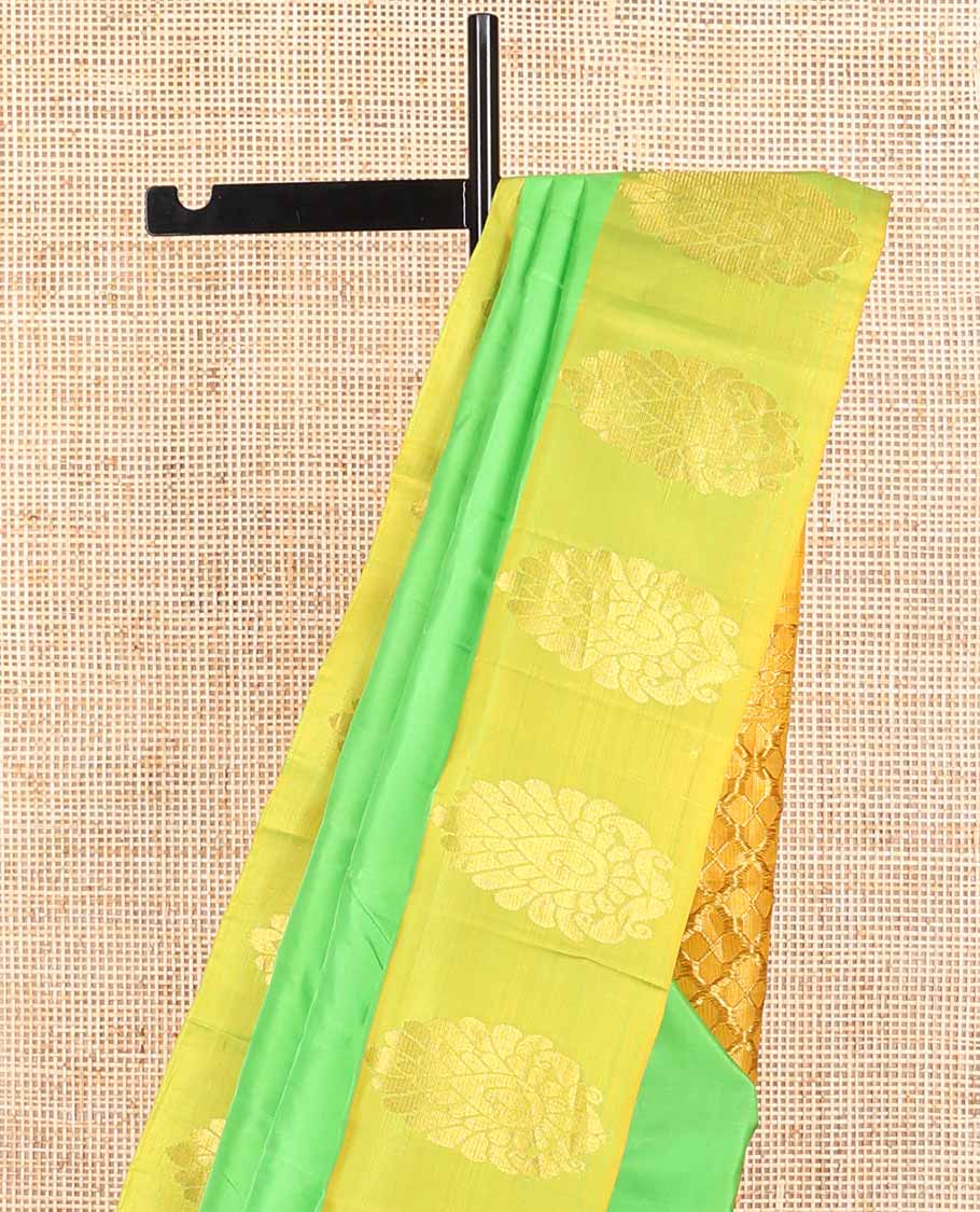 Light green kancheepuram silk sare with contrast floral design border & argyle design pallu