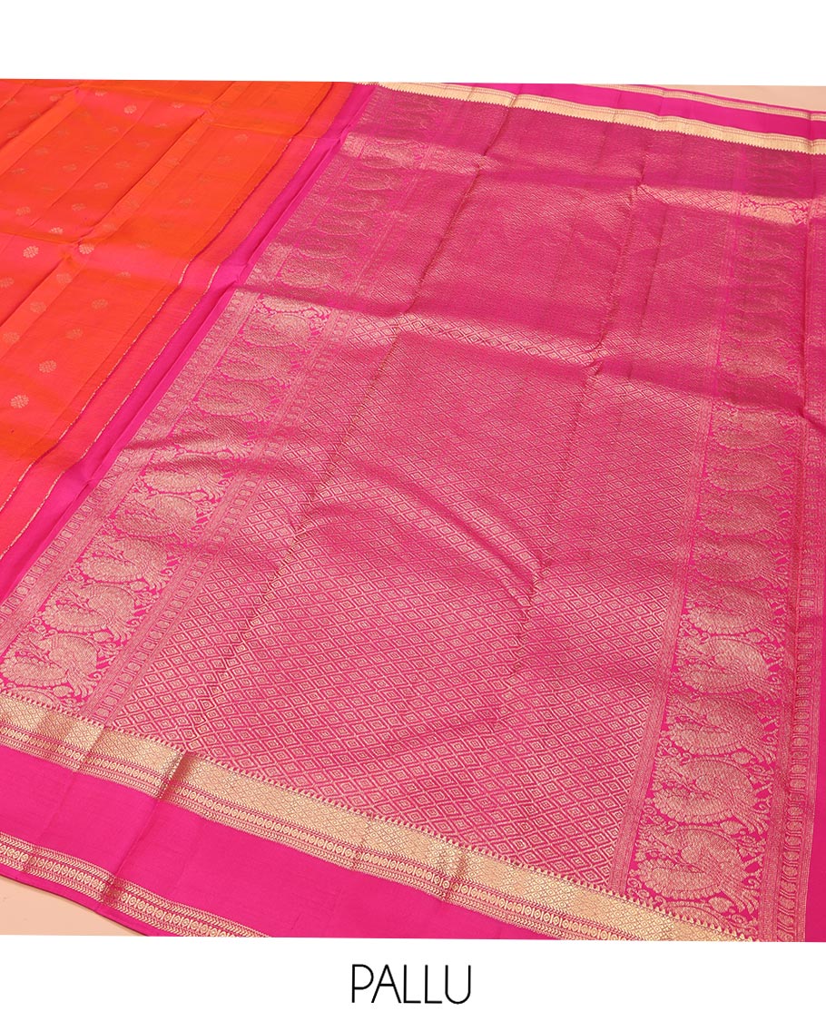 Orange Kanchipuram Silk Saree, Elevated with Zari Buttas on Its Body, Complemented by a Contrast Rettai Pettu Border of Rekku, Mayil Kann, and Kathir Designs, Grand Pallu of Jaal Designs, and Paired with a Contrast Blouse
