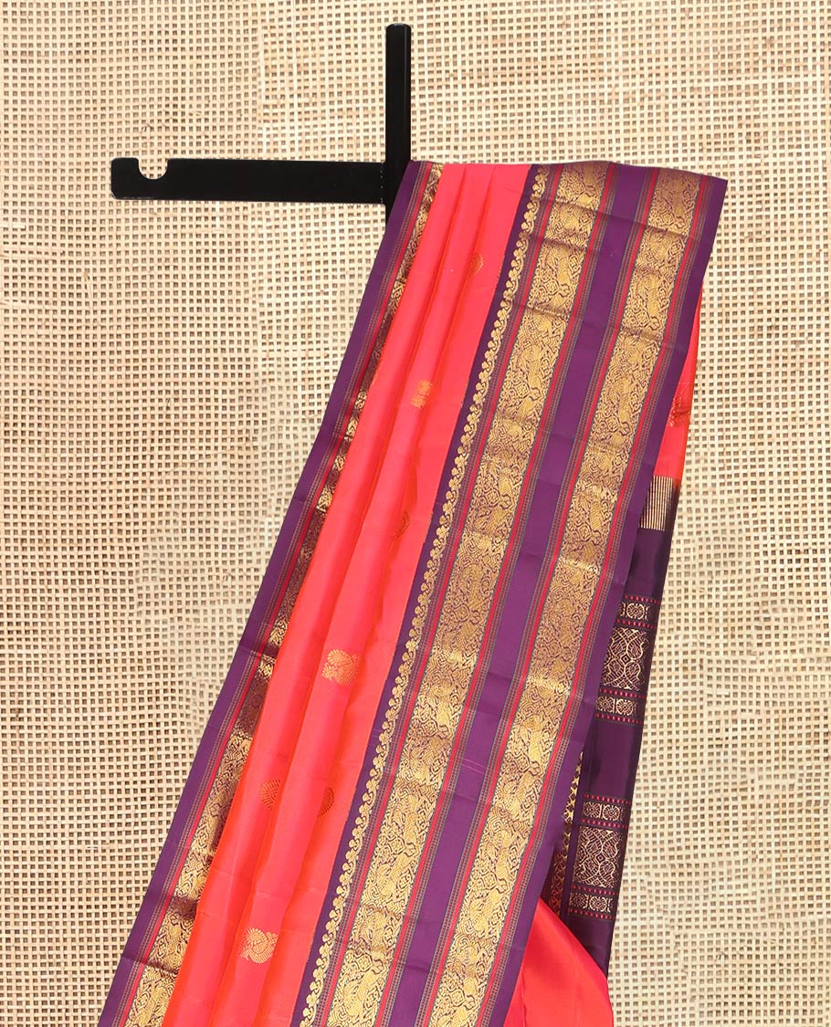 Orange Kanchipuram Silk Saree, Graced with Mayil-Chakram Buttas, a Contrast Korvai Rettai Pettu Border of Muthu, Muthu, and Kuthirai Designs, Traditional Pallu, and a Contrast Blouse