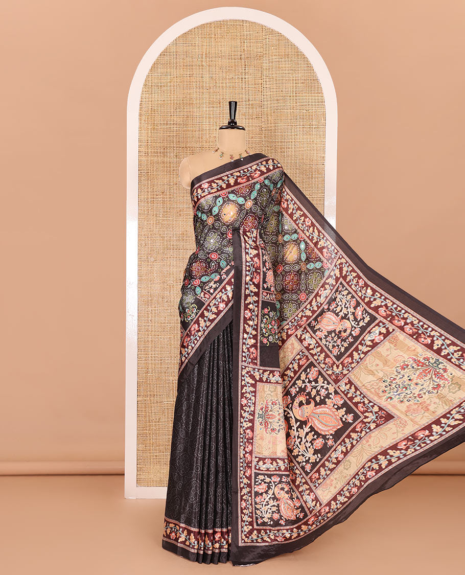 Black bandhani printed and mirror work masakali saree, floral creeper printed border, pallu of floral-peacock print, and a matching blouse