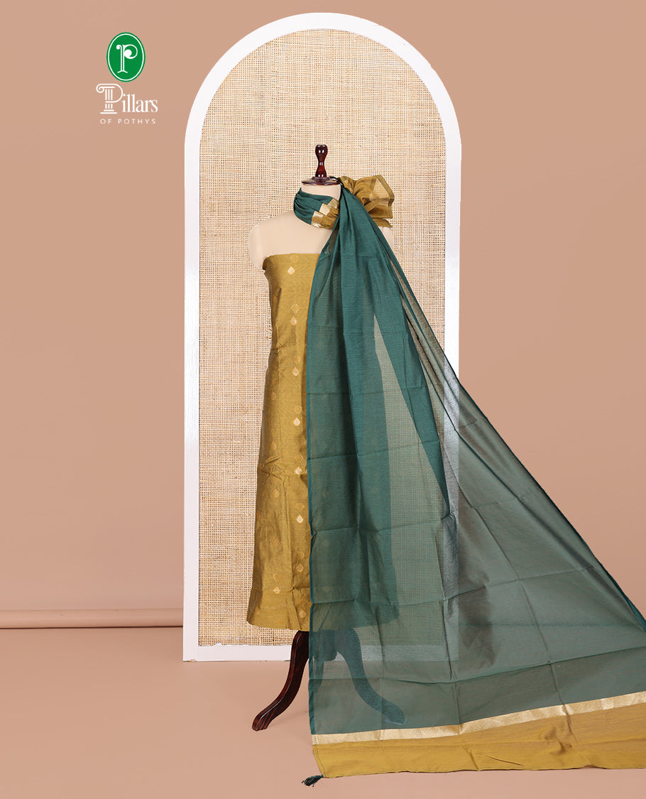 Mustard Yellow Semi-Chanderi Material Churidar Features Floral Buttas Top, a Plain Bottom, and a Contrast Dupatta