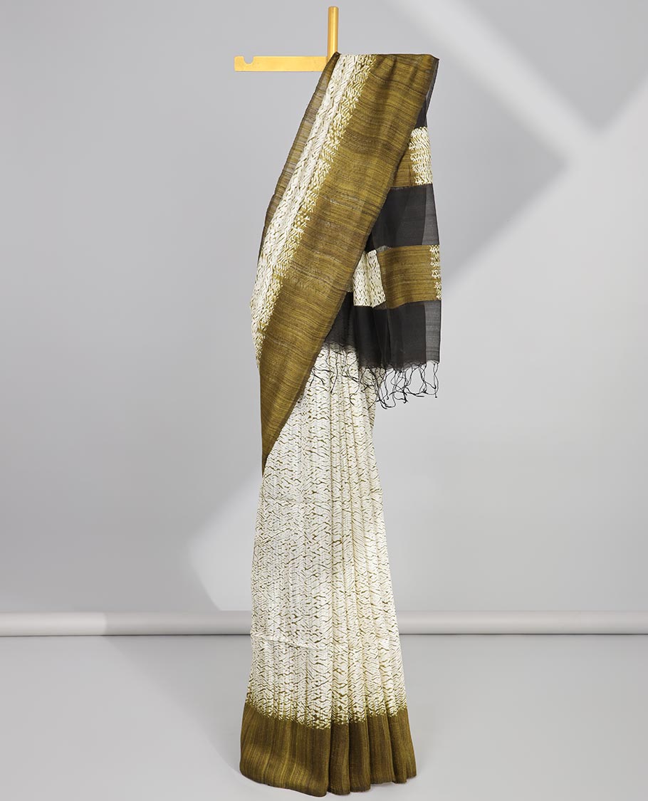 White abstract design matka silk saree with contrast plain border & green abstract design pallu