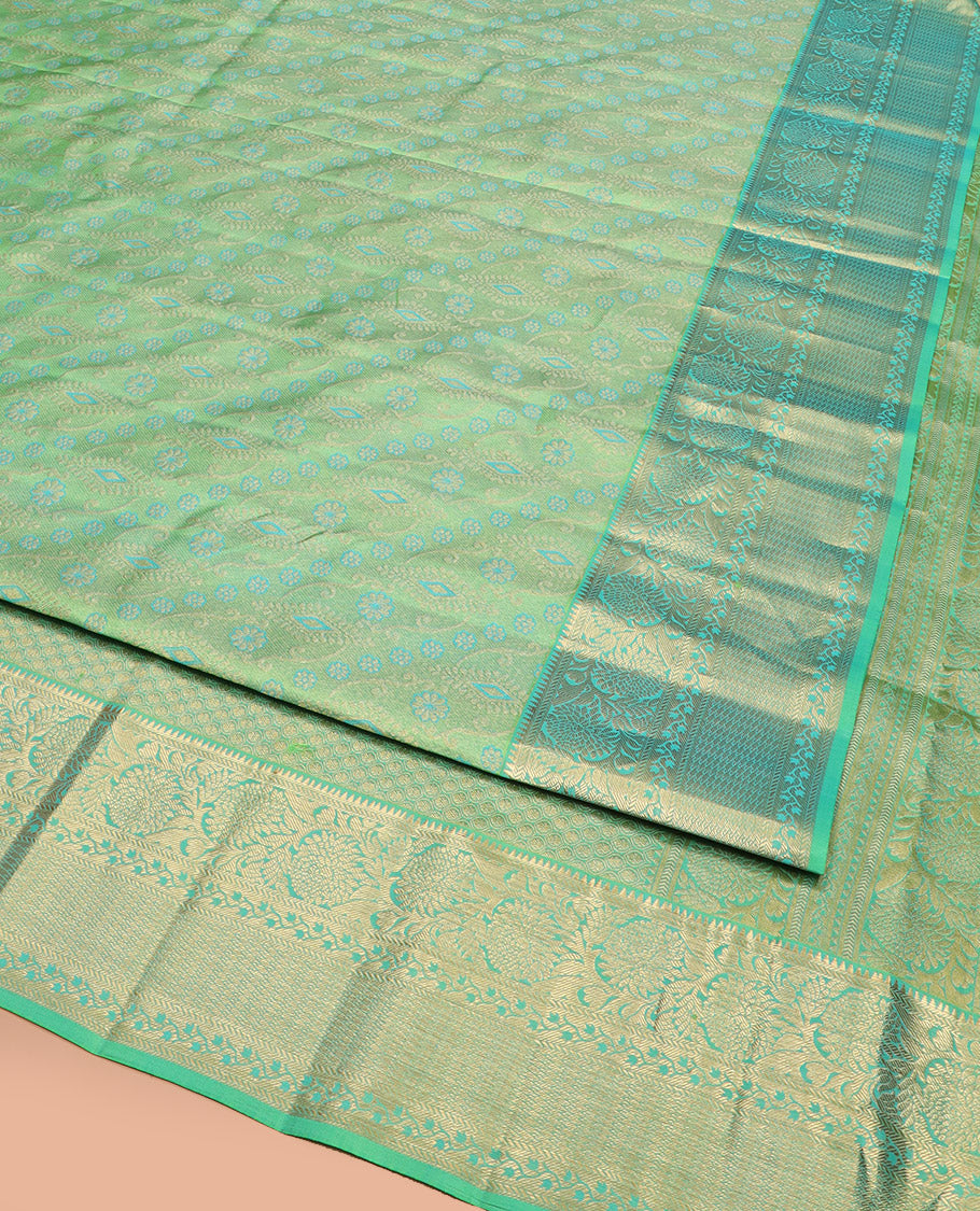 Green Kanchipuram Wedding Silk Saree Beautifully Bedecked with Meenakari Jacquard Designs, Highlighted with Contrast Border of Rekku, Kathir, and Kodi Visiry Designs, Grandly Decked Up Pallu of Jaal Designs, and Paired with a Contrast Blouse