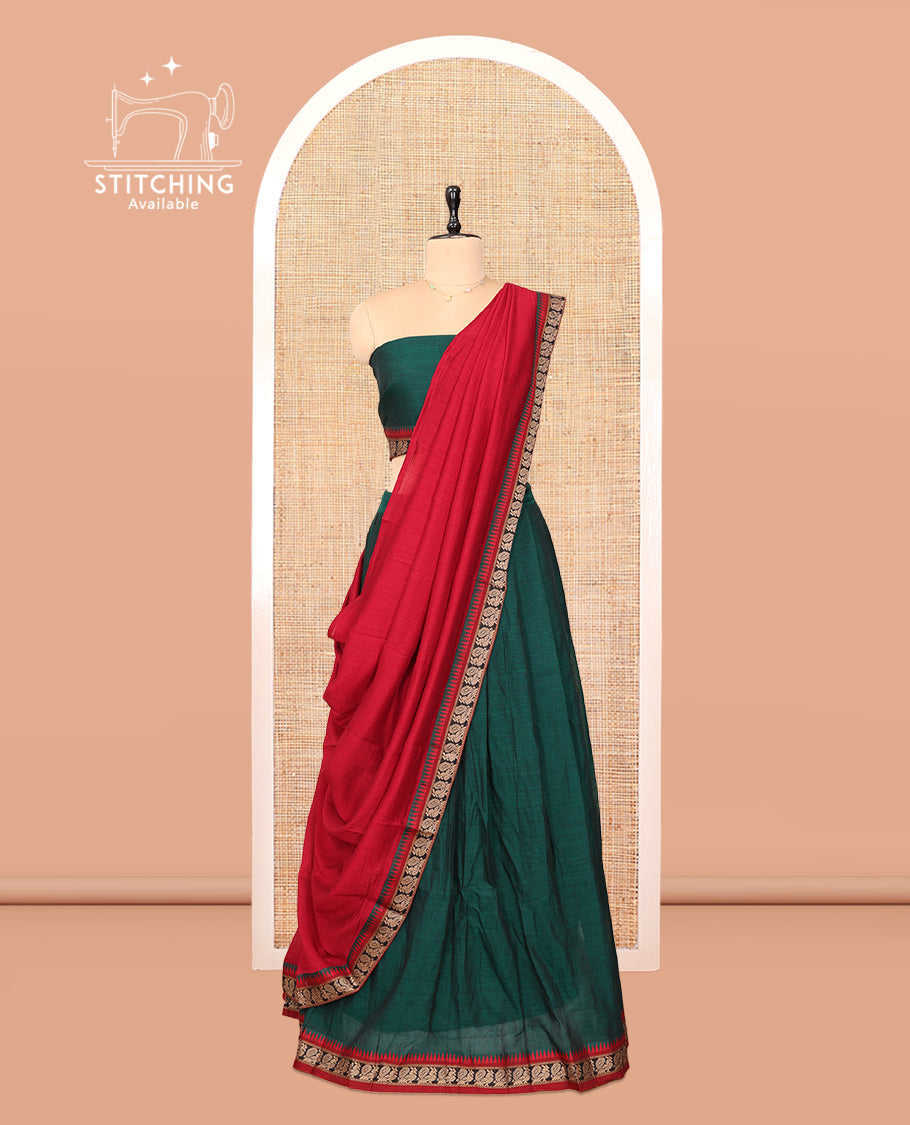 Green Cotton Half-Saree Features Plain Skirt, a Contrast Peacock Border, a Matching Blouse, and a Contrast Dhavani