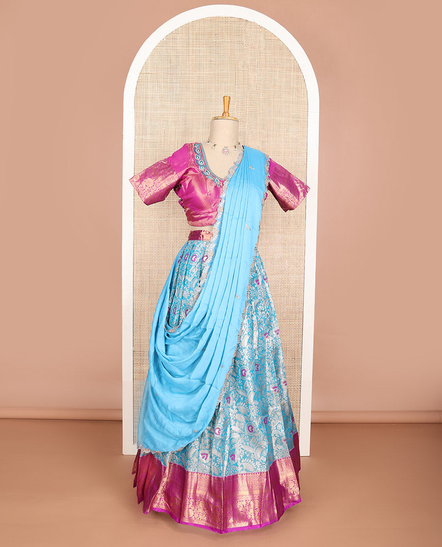 Light blue floral art silk half saree with contrast zari design border, embroidered blouse & floral embroidery dhavani