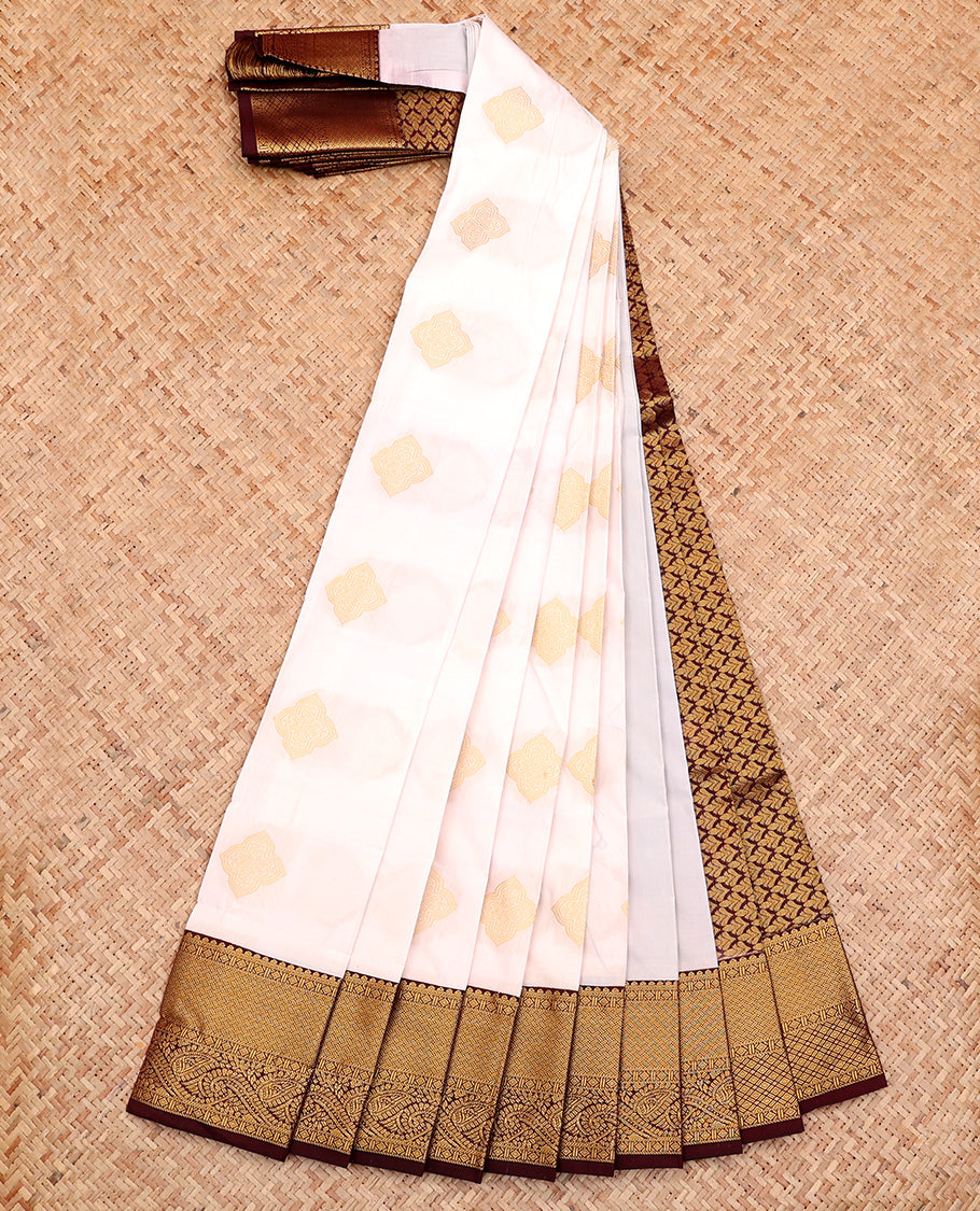 White Budget Silk Saree, Elevated with Buttas All Over Its Body, Complemented by a Contrast Traditional Zari Design Border, Intricately Designed Pallu, and Paired with a Contrast Blouse