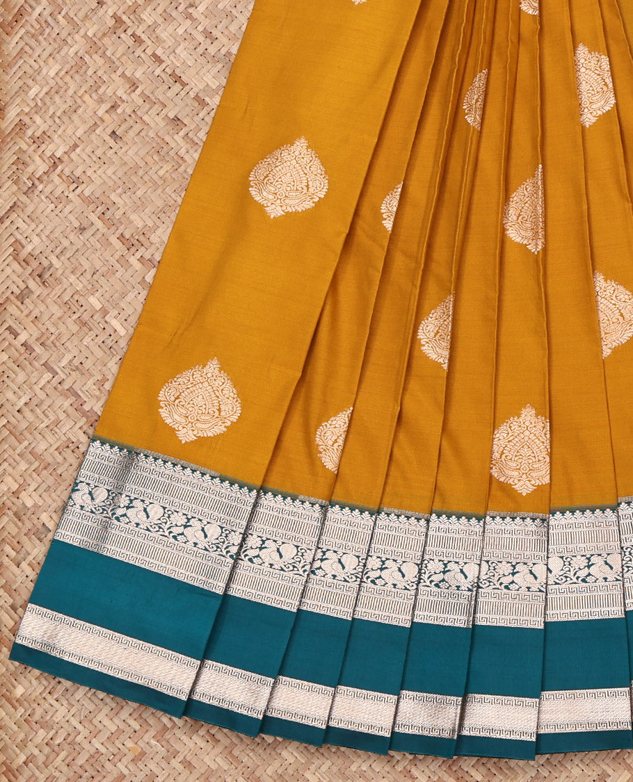 Yellow Budget Silk Saree, Adorned with Zari Buttas All Over Its Body, Complemented by a Contrast Traditional Zari Design Rettai Pettu Border, Grandly Decked Up Pallu, and Paired with a Contrast Blouse
