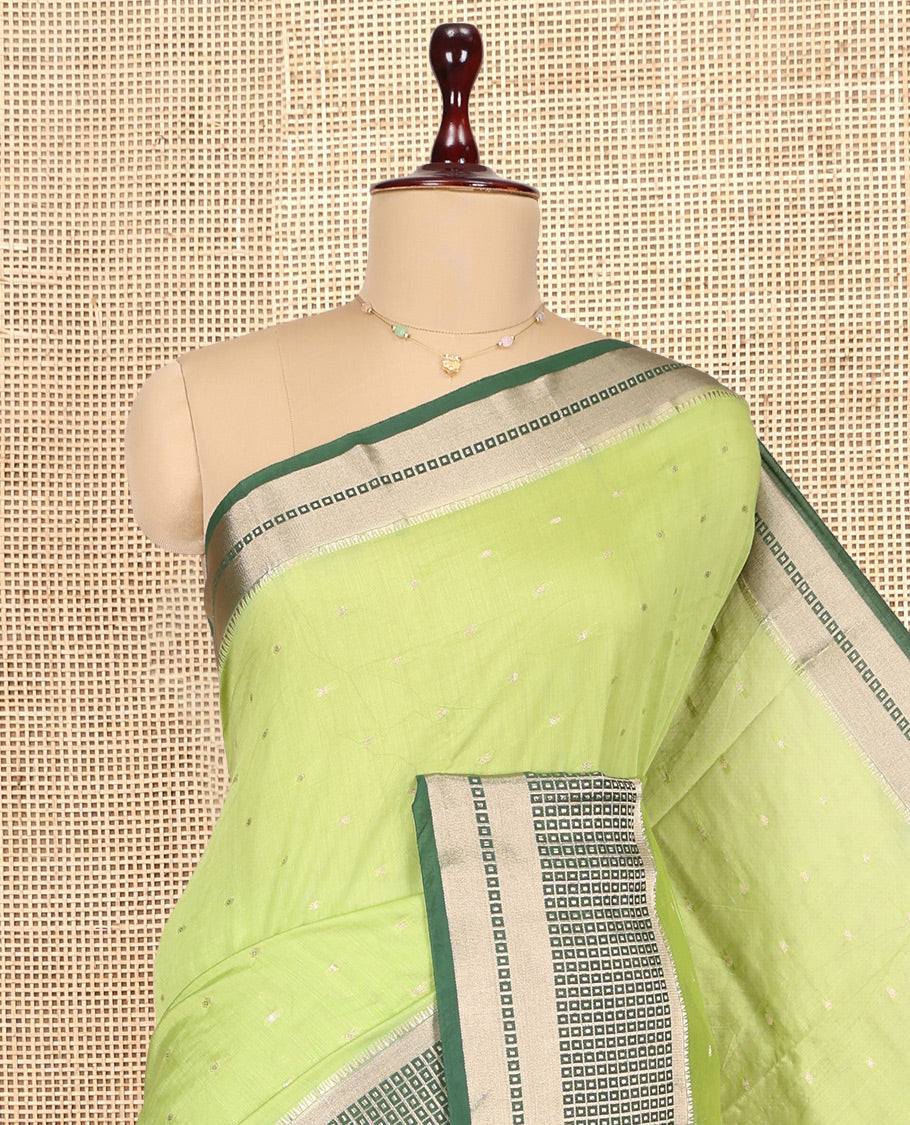 Green Assam Silk Saree, Graced with Zari Buttas, Complemented by Contrast Traditional Zari Border, Zari Woven Pallu, and Contrast Blouse