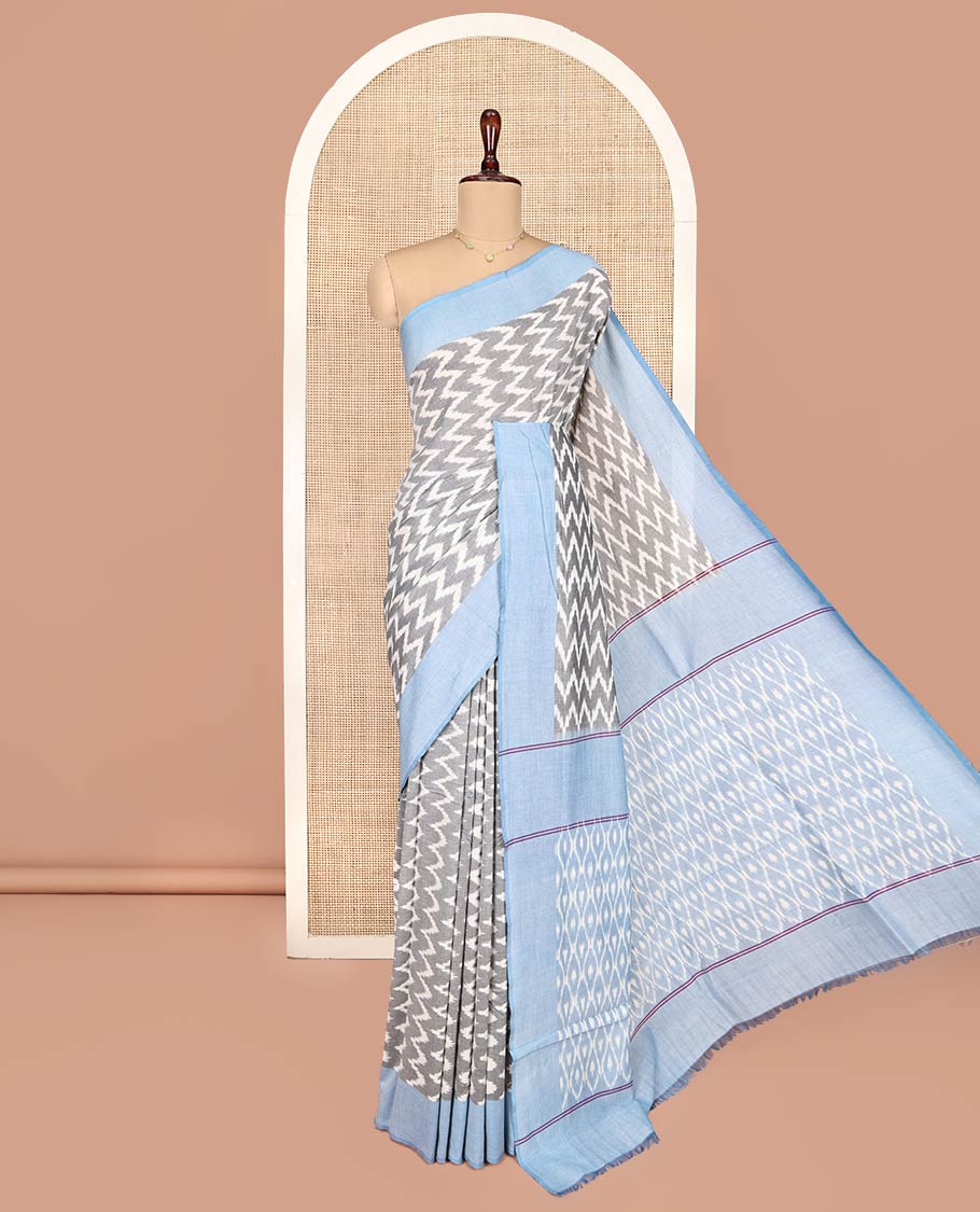 Grey Ikkat Cotton Saree, Bedecked with Ikkat-Style Chevron Stripes on Its Body, Complemented by Contrast Border, Pallu of Ikkat Ogee Patterns, and Has No Blouse