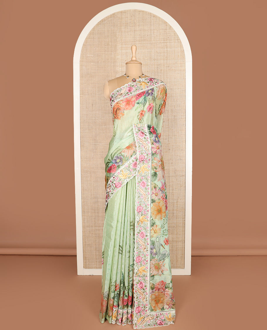 Pista green buttas with floral printed dola silk saree, contrast floral embroidered scallop border