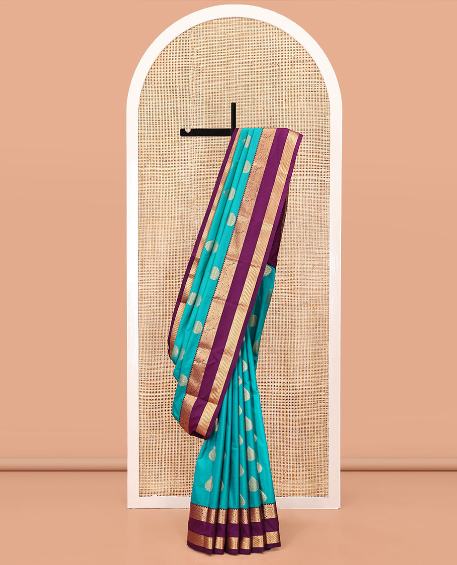 Rama Green and Purple Budget Silk Saree, Accentuated with Zari Buttas All Over Its Body, Complemented by Contrast Rettai Pettu Traditional Zari Designs Woven Border, Grand Pallu and Paired with a Contrast Blouse