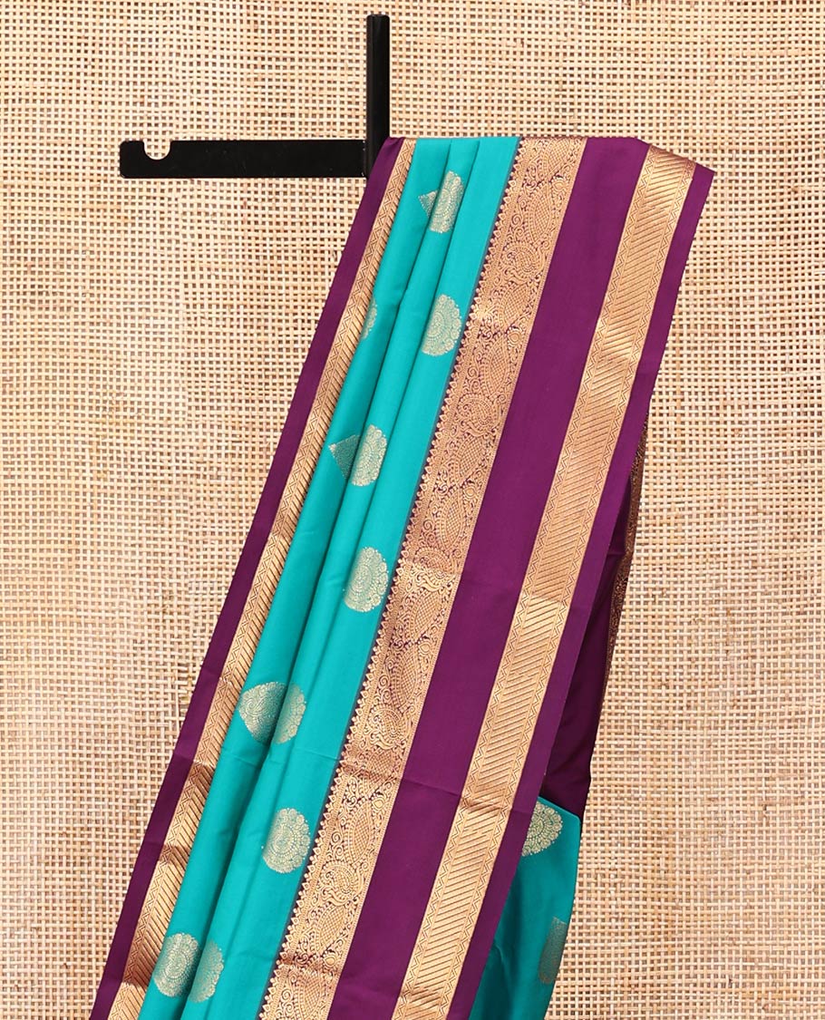 Rama Green and Purple Budget Silk Saree, Accentuated with Zari Buttas All Over Its Body, Complemented by Contrast Rettai Pettu Traditional Zari Designs Woven Border, Grand Pallu and Paired with a Contrast Blouse