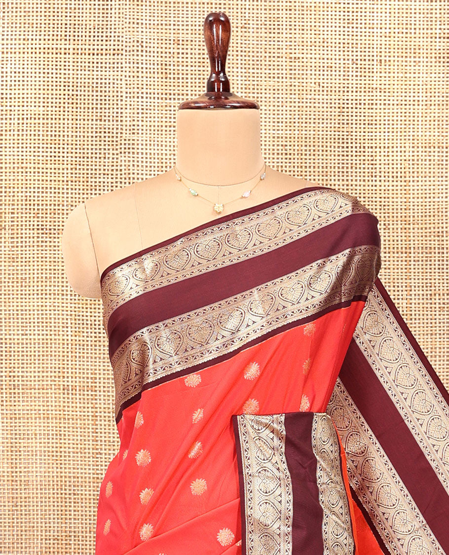 Orange and Brown Budget Silk Saree, Adorned with Zari Buttas All Over Its Body, Complemented by Contrast Rettai Pettu Traditional Zari Border of Jada Nagam, Pallu Steeped with Paisleys, and Paired with a Contrast Blouse