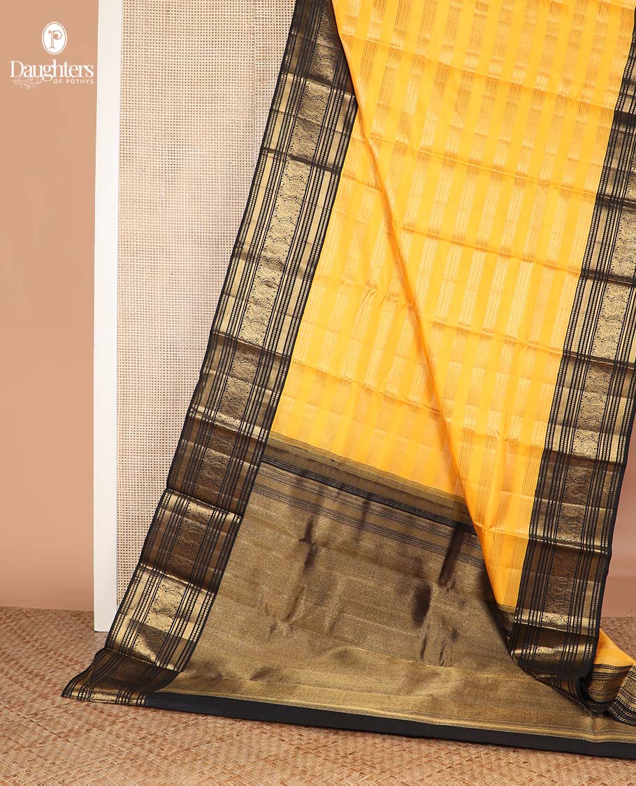 Yellow zari striped Kanchipuram silksaree, contrast border of kathir, and mayil designs, and pallu of mayil kann designs