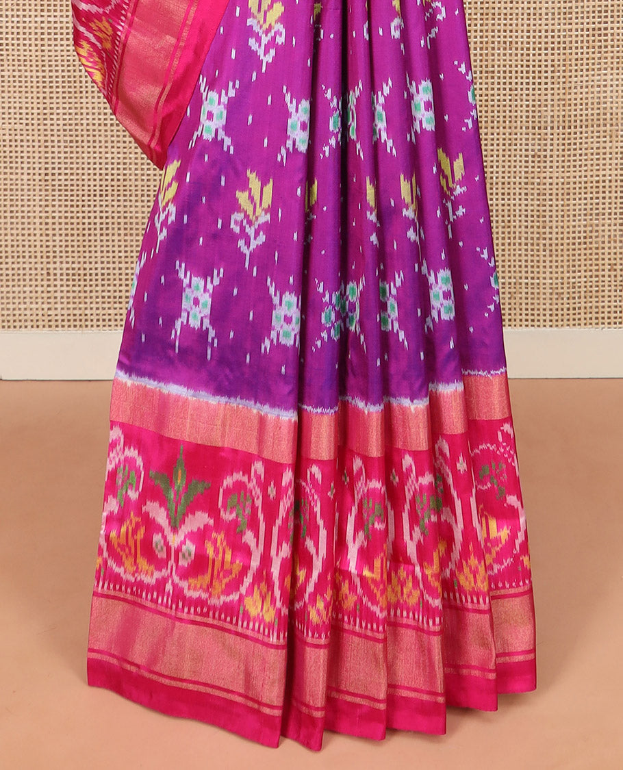 Rani Pink Ikkat Silk Saree Adorned with Colourful Buttas, Complemented by an Ikkat Woven Border, a Colourfully Woven Ikkat Pallu, and a Contrast Blouse
