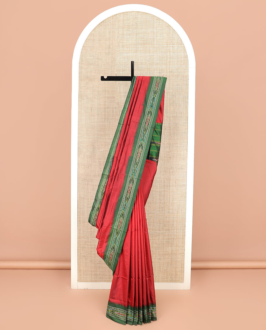 Persian Red Plain Ikkat Silk Saree with a Contrast Green Border Beautified by a Hazy Ikkat Weave, and a Pallu Depicting Stripes and Ikkat Texture