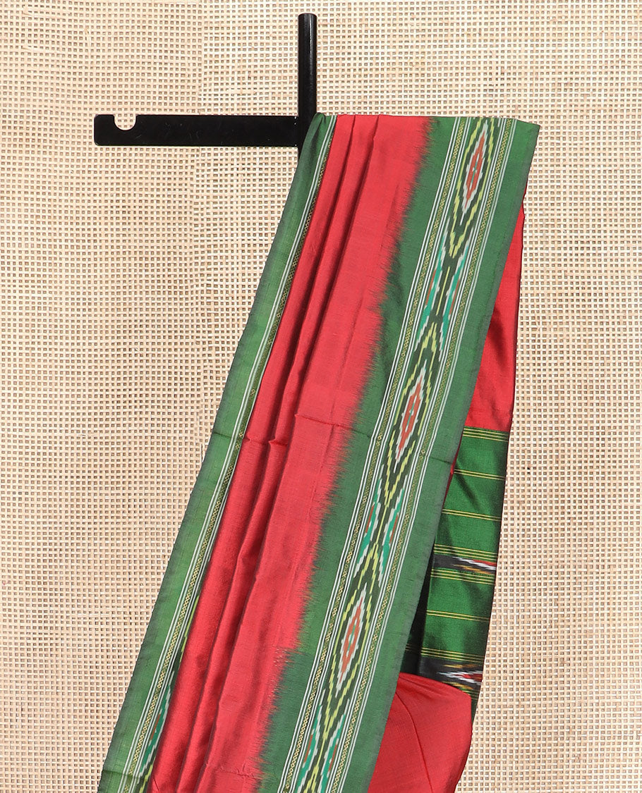 Persian Red Plain Ikkat Silk Saree with a Contrast Green Border Beautified by a Hazy Ikkat Weave, and a Pallu Depicting Stripes and Ikkat Texture