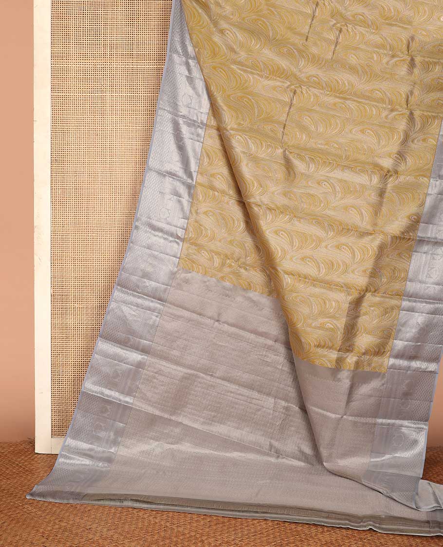 Yellow jacquard Kanchipuram tissue silk saree, contrast border of thilakam mokku, muthu, kathir, puli nagam, and jaal designs, and butta enclosed checks