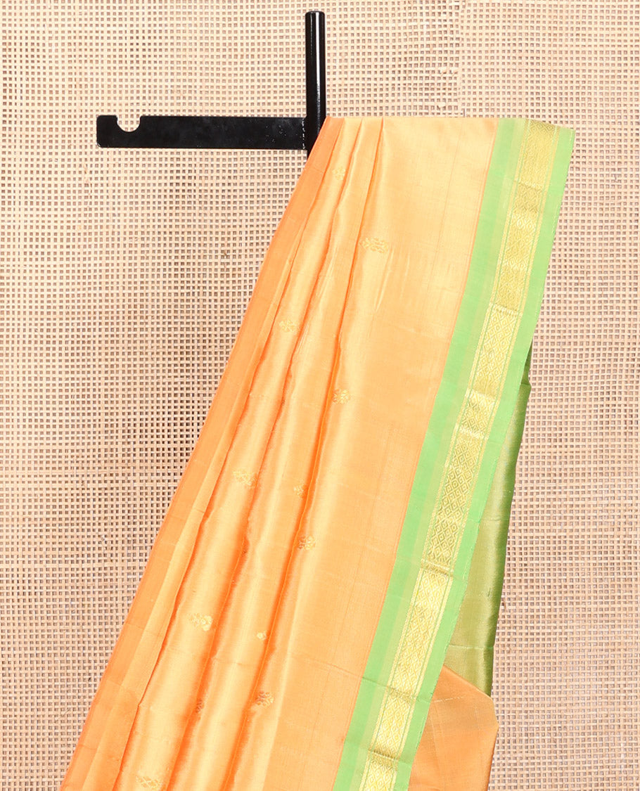 Orange Kanchipuram Silk Saree, Sparsely Woven with Zari Buttas, a Contrast One-Sided Border of Mayil Kann Designs, a Zari-Design Pallu, and No Blouse