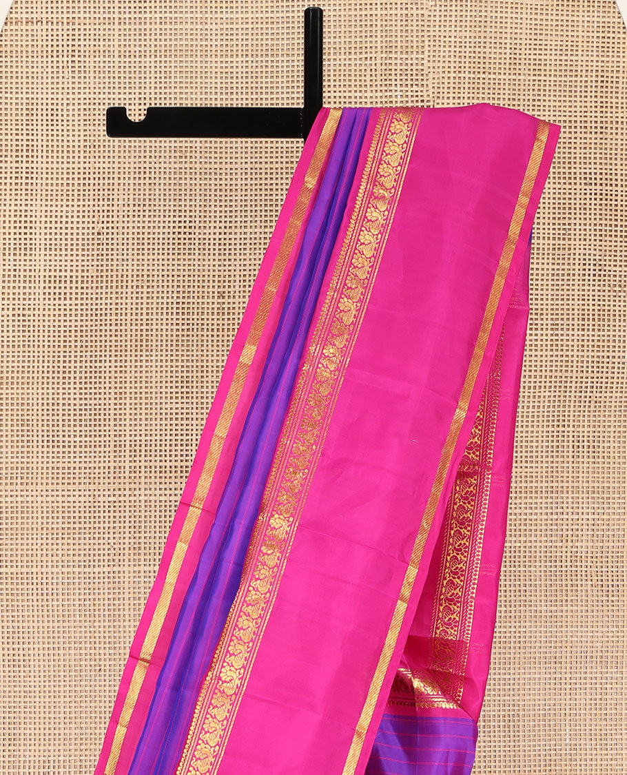 Violet Kanchipuram Silk Saree, Beautified with Stripes on Its Body, Complemented by a Contrast Rettai Pettu Border of Thilakam Mokku, Banaras, Muthu, and Mayil Designs, Subtly Zari Striped Pallu, and Paired with a Contrast Blouse