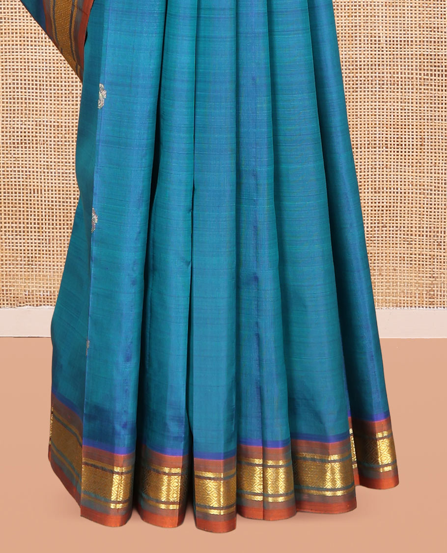 Blue Kanchipuram Silk Saree, Elevated with Zari Buttas, Complemented by a Contrast One-Sided Border of Banaras, and Mayil Kann Designs, Zari Woven Pallu, and a No Blouse