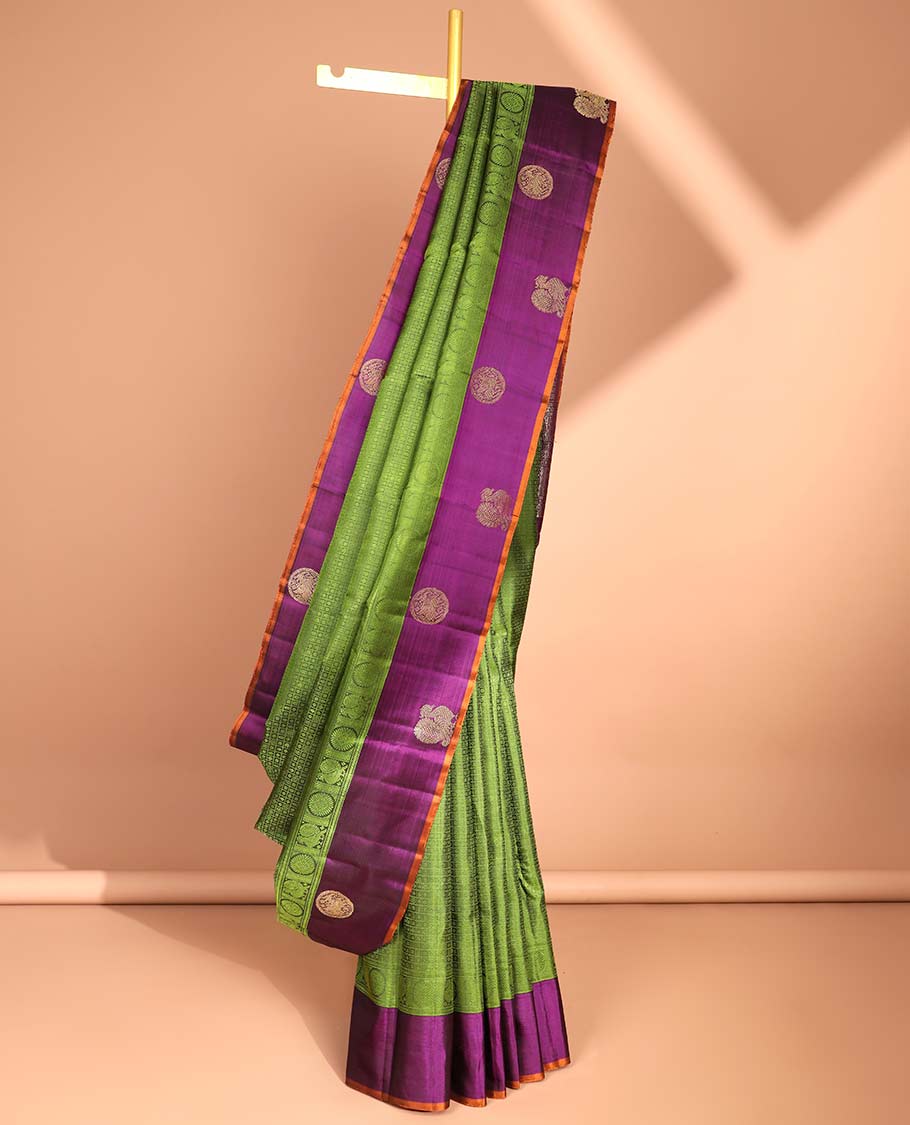Green floral enclosed with checked design silk saree with contrast border of mayil & intricate zari design pallu