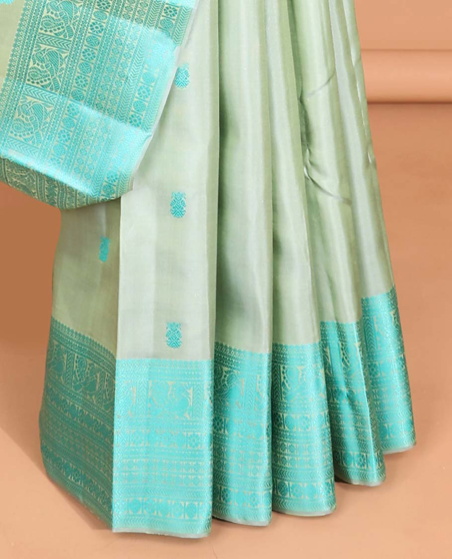 Green buttas kancheepuram silk saree with contrast border of intricate zari design & striped floral design pallu
