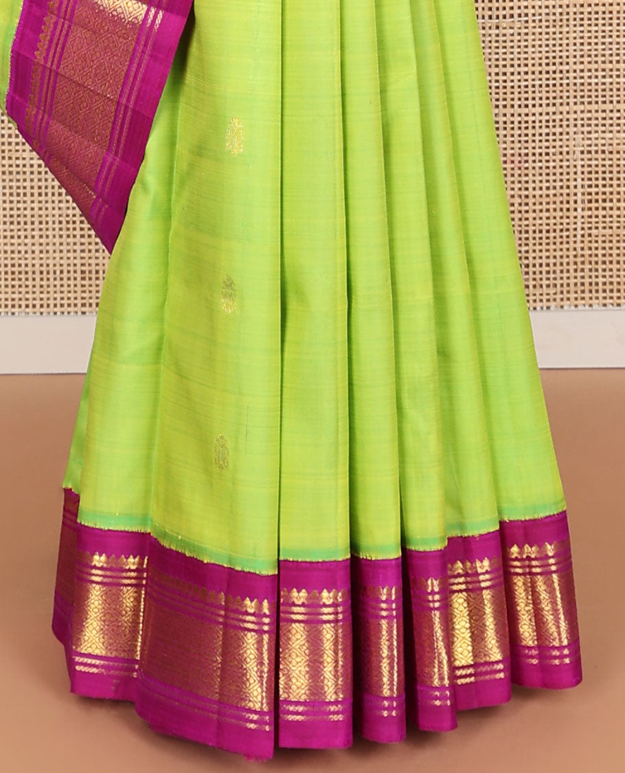 Green buttas kanceepuram silk saree with contrast korvai border of thilakam mokku, banaras design & zari design pallu