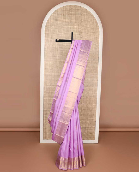 Purple buttas kancheepuram silk saree with self border of rekku,paun, mayil kann design & argyle design pallu
