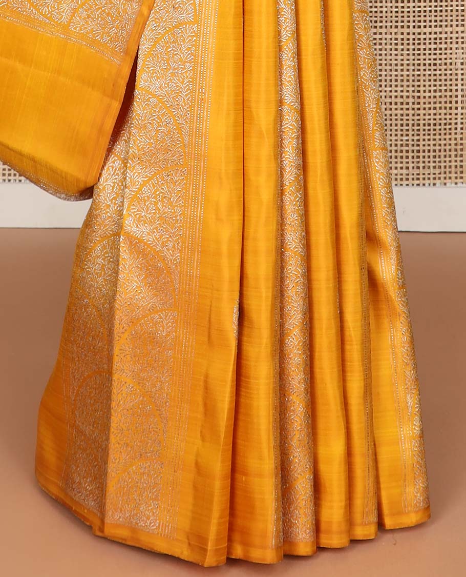 Borderless orange floral design kancheepuram silk saree with argyle design pallu