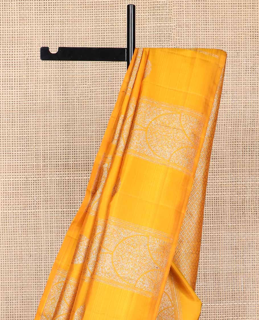 Borderless orange floral design kancheepuram silk saree with argyle design pallu