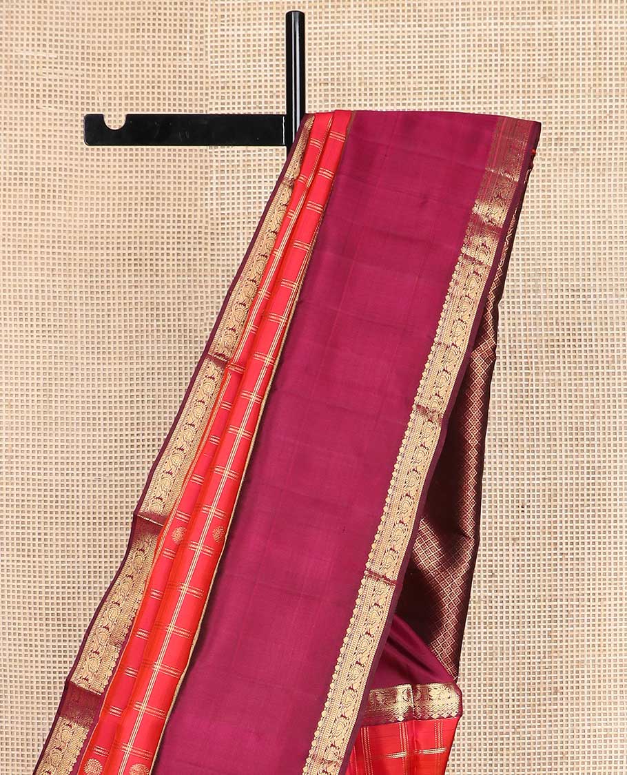 Red checked with zari buttas Kanchipuram silk saree, contrast rettai pettu border of thilakam, muthu, annam chakram designs, and jaal pallu