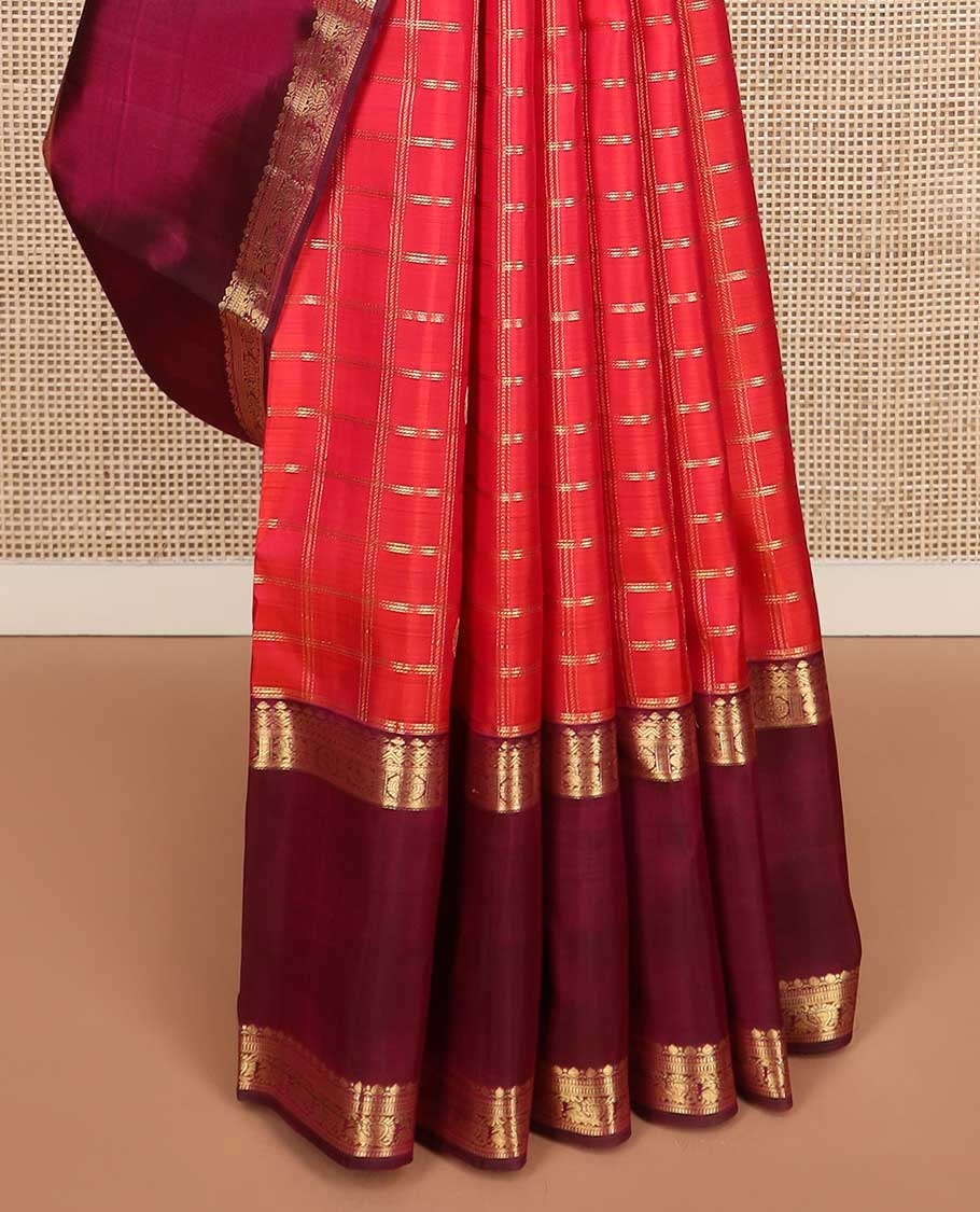 Red checked with zari buttas Kanchipuram silk saree, contrast rettai pettu border of thilakam, muthu, annam chakram designs, and jaal pallu