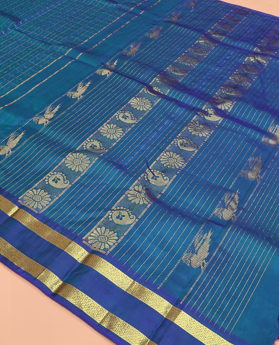 Blue zari checked Kanchipuram silk saree, rettai pettu diamond patterned border, and pallu of annam, kamalam, and manga designs