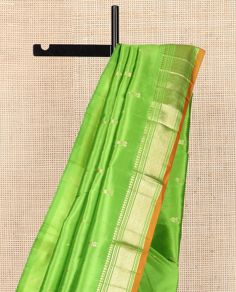 Green zari buttas Kanchipuram silk saree, zari border of paneer sombu, banaras, muthu, and jaal designs, and zari design pallu