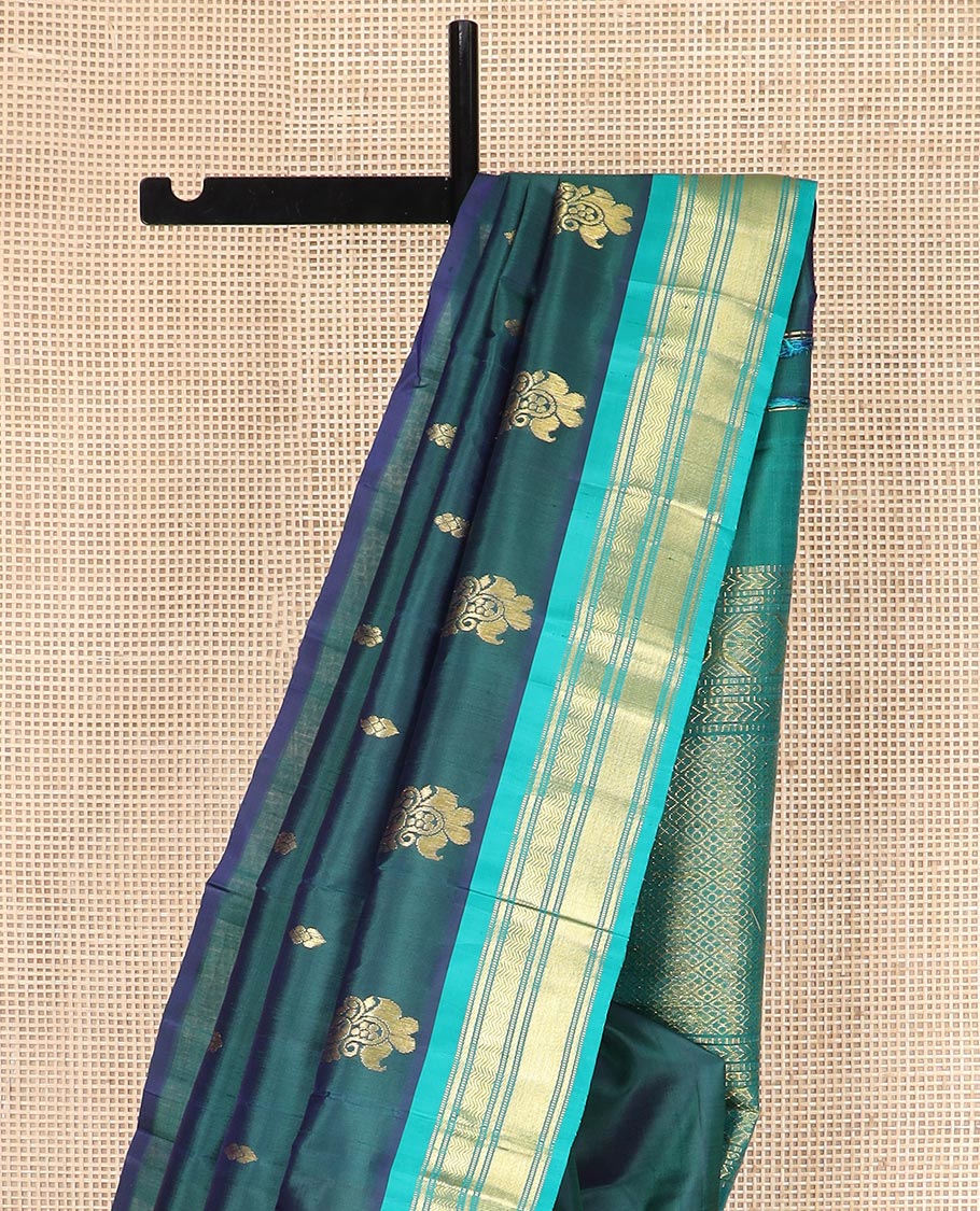 Green Kanchipuram Silk Saree, Finely Woven with Zari Buttas All Over Its Body, Complemented by Contrast One-sided Border Featuring Muthu, Kathir, and Vanki Designs, Zari Elevated Pallu of Jaal Designs, and Comes Without a Blouse