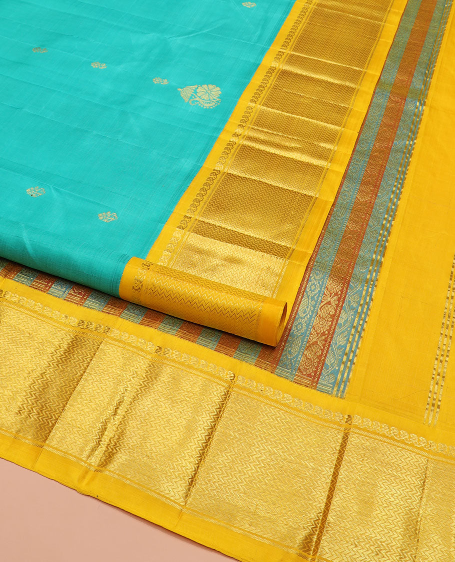 Turquoise Kanchipuram Silk Saree Prettified with Zari Buttas All Over Its Body, Complemented by Contrast One-Sided Korvai Border of Manga Mokku, and Vanki Designs, Pallu Steeped with Floral-Paisley Designs, and Comes Without a Blouse
