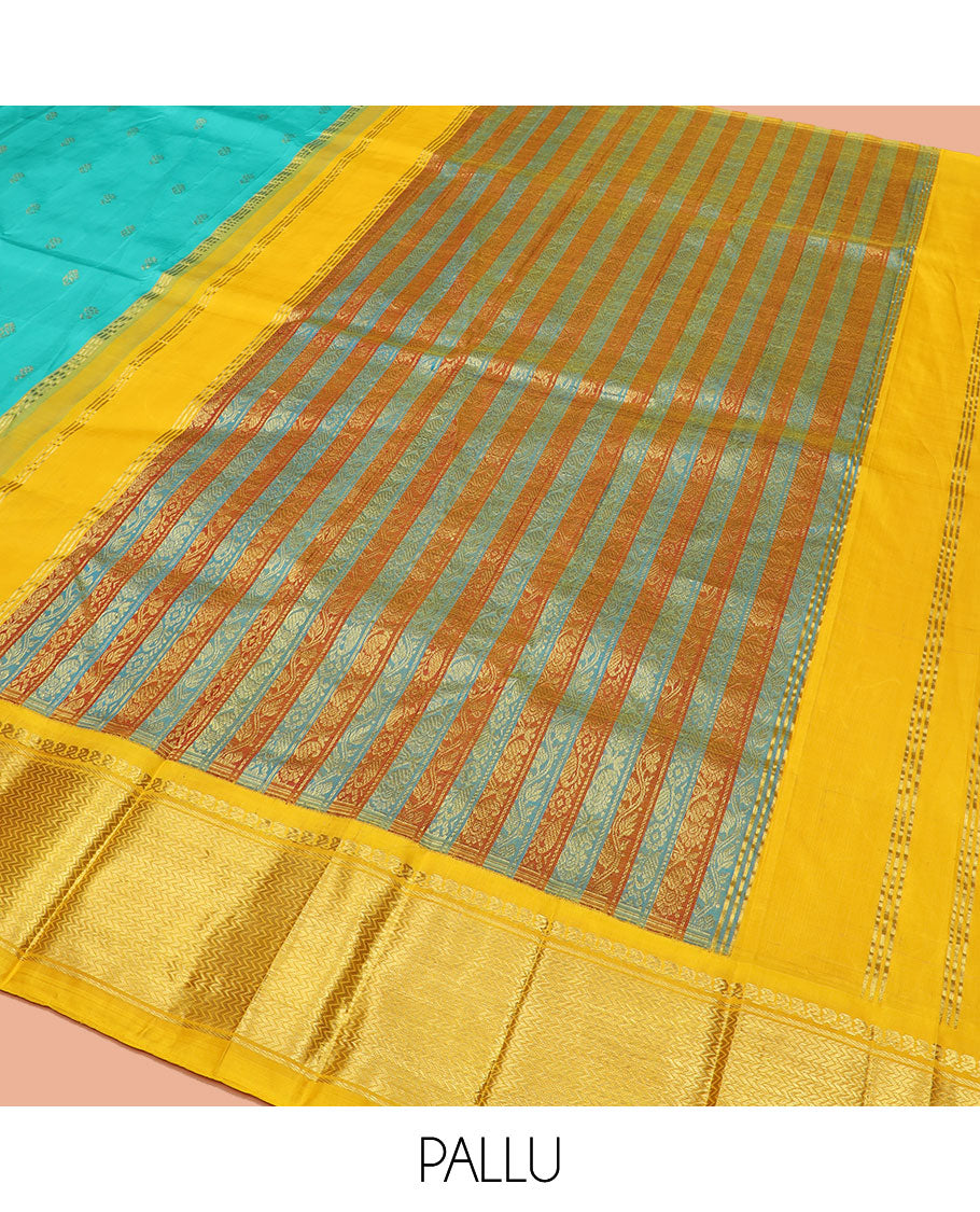 Turquoise Kanchipuram Silk Saree Prettified with Zari Buttas All Over Its Body, Complemented by Contrast One-Sided Korvai Border of Manga Mokku, and Vanki Designs, Pallu Steeped with Floral-Paisley Designs, and Comes Without a Blouse