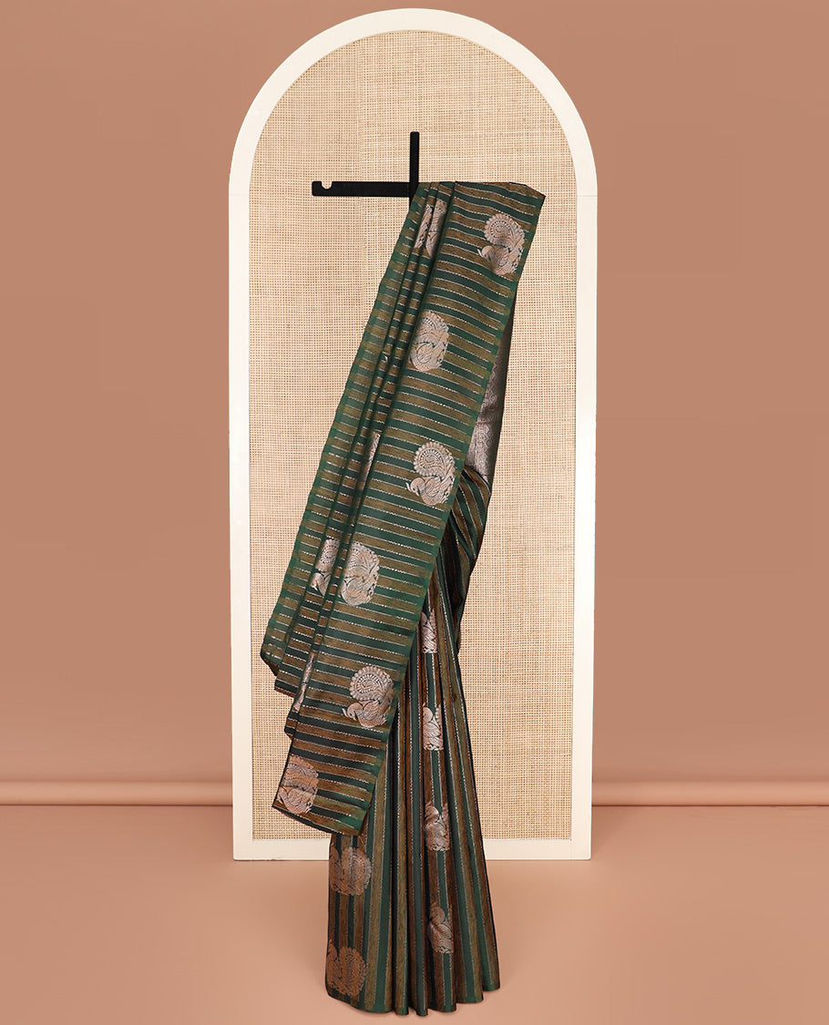 Borderless Green Kanchipuram Silk Saree Highlighted by Annam Buttas and Stripes All Over Its Body, Subtly Sparkled Pallu of Rudraksham, Muthu, Kathir, and Laddu Kamalam Designs, and Paired with a Matching Blouse