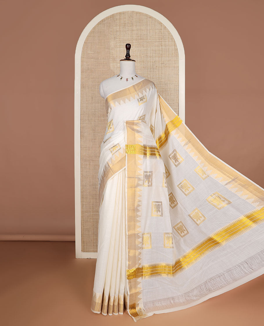Cream zari Pichwai lotus buttas Kerala saree, zari temple border, and pallu of Pichwai lotus motifs