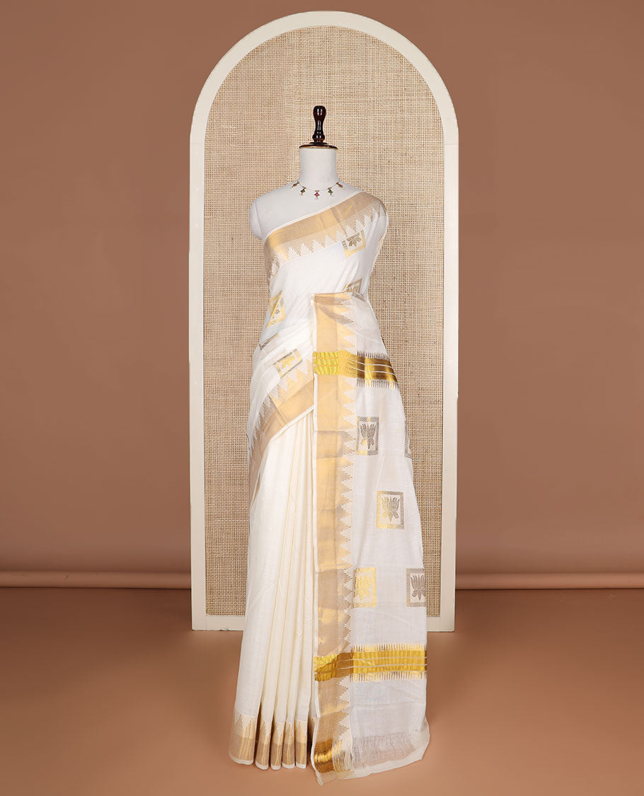 Cream zari Pichwai lotus buttas Kerala saree, zari temple border, and pallu of Pichwai lotus motifs