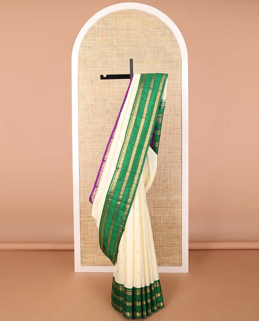 White floral buttas kancheepuram silk saree with contrast ganga jamuna, korvai border of thilakam mokku, poo chakram, mayil design & zari design pallu