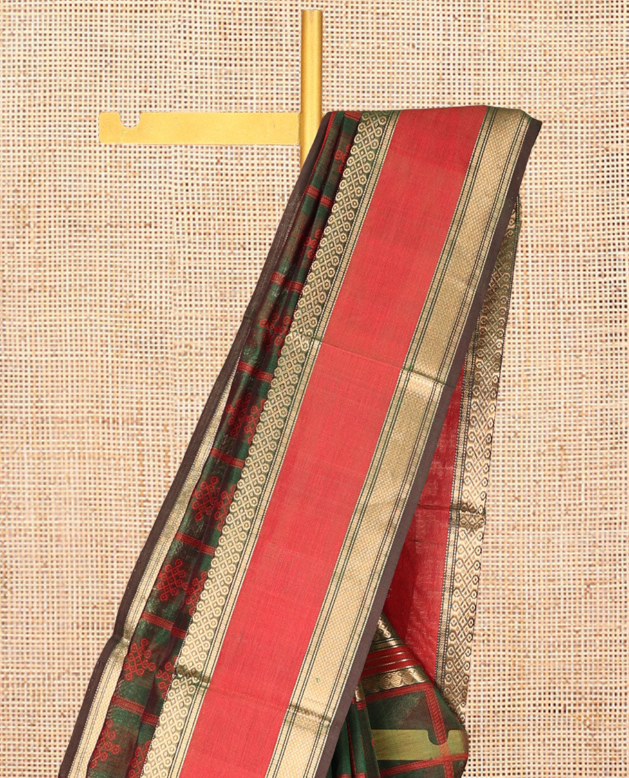 Green Kuppadam Silk Saree, Mesmerised with Kolam Butta Enclosed Checks, a Contrast Traditional Kolam Border, Pallu of Kolam Designs, and a Matching Blouse