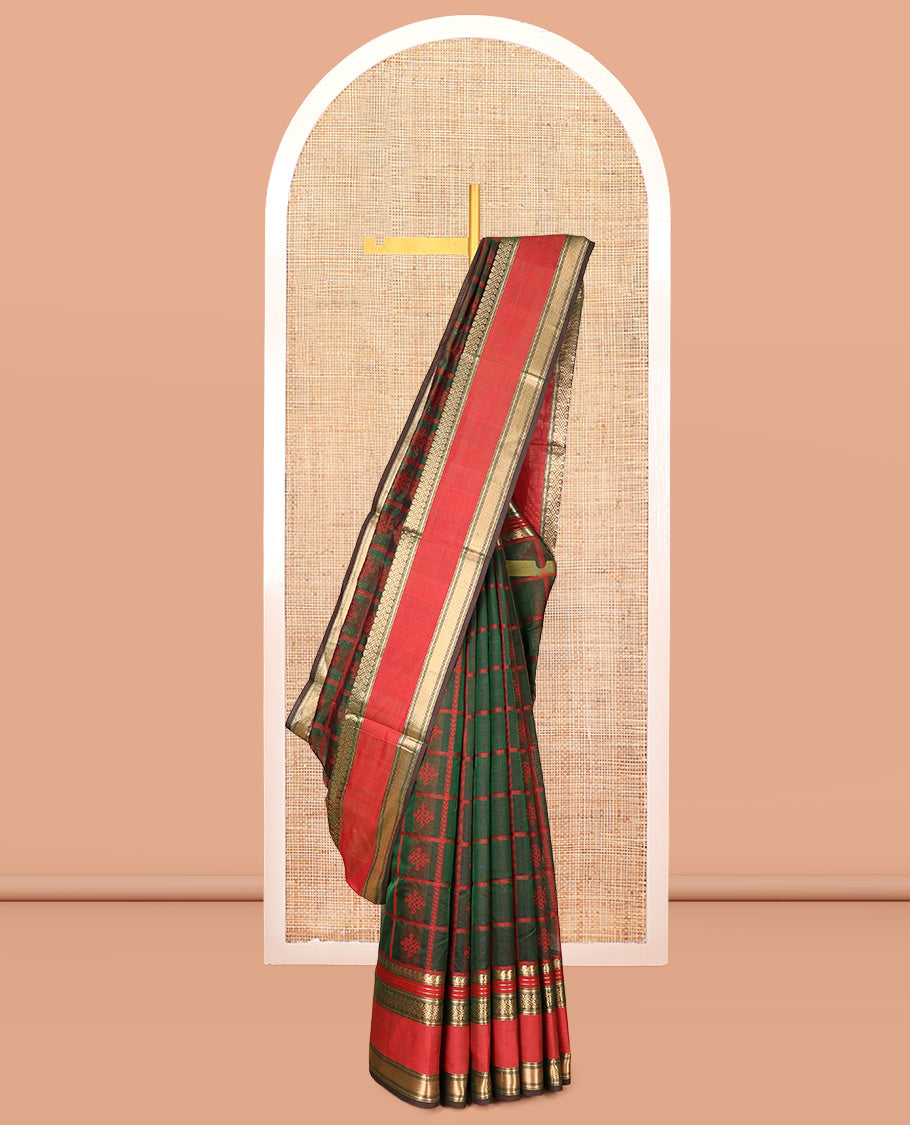 Green Kuppadam Silk Saree, Mesmerised with Kolam Butta Enclosed Checks, a Contrast Traditional Kolam Border, Pallu of Kolam Designs, and a Matching Blouse