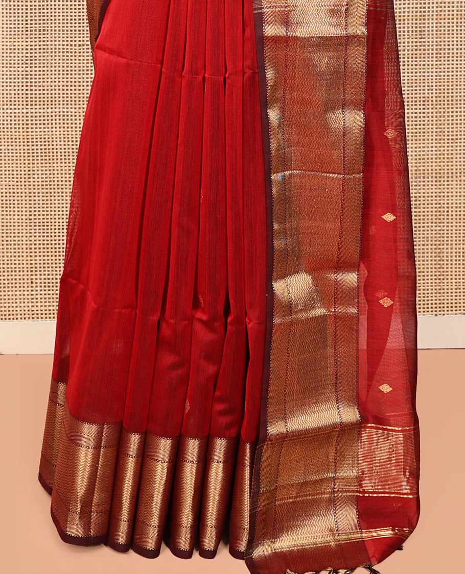 Red Maheshwari Cotton Saree, Accentuated with Buttas All Over Its Body, Complemented by a Contrast Traditional Zari Woven Border of Chevron Designs, Pallu Mirrors the Same Design, and Paired with a Matching Blouse