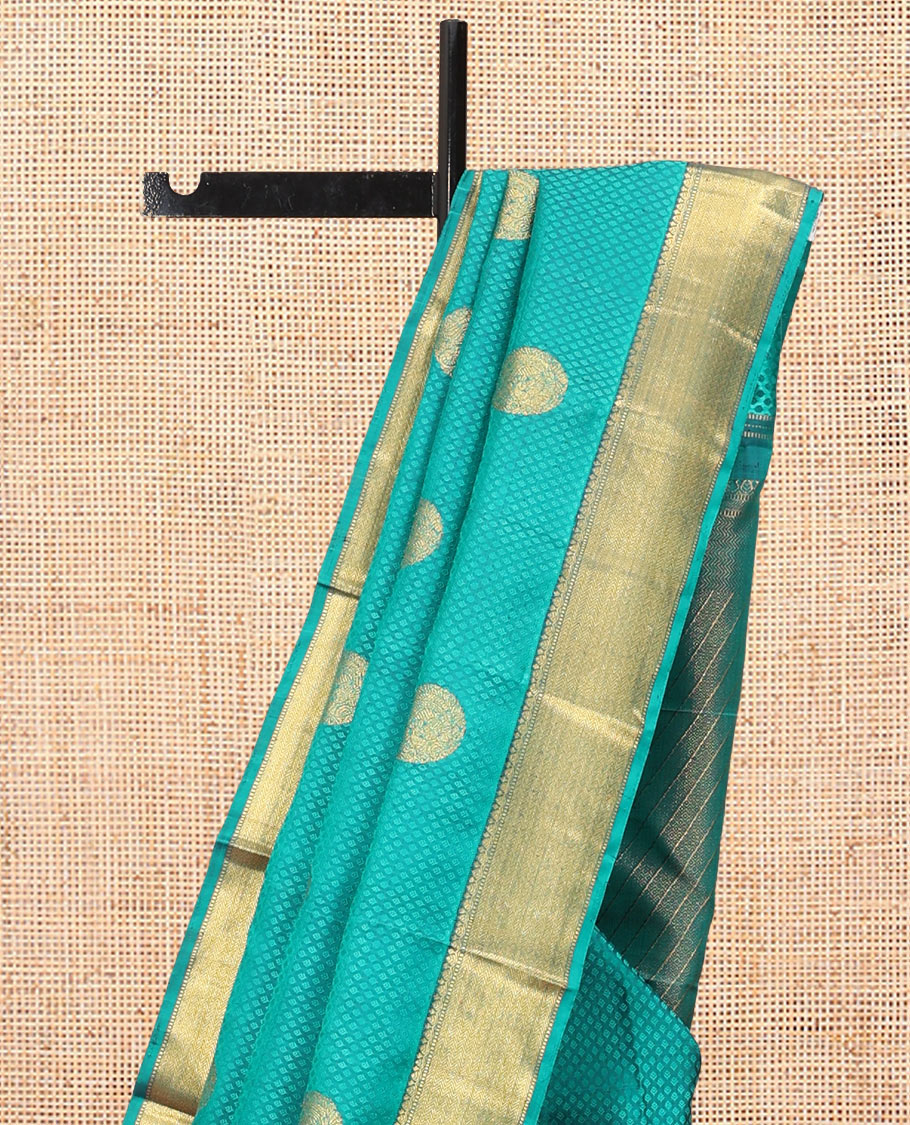 Blue Embossed Parampara Silk Saree, Features Zari Buttas, a Zari Border of Thilakam, Muthu, and Vanki Designs, Grand Pallu, and a Matching Blouse