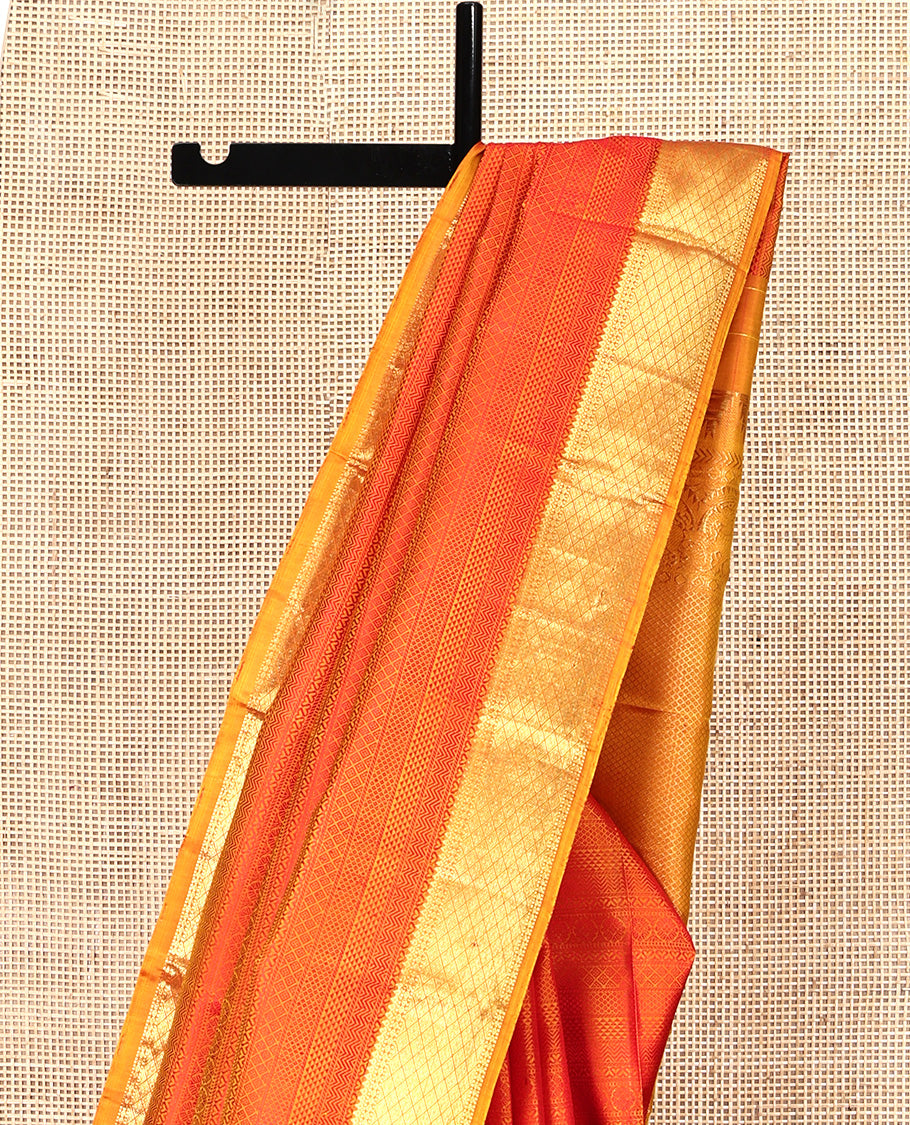 Red Parampara Silk Saree, Subtly Sparkled With Geometric Embossed Patterns in Its Body, Highlighted by Contrast Jaal Design Zari Border, Pallu of Mayil Kann and Yaali Designs , and Paired with a Contrast Blouse