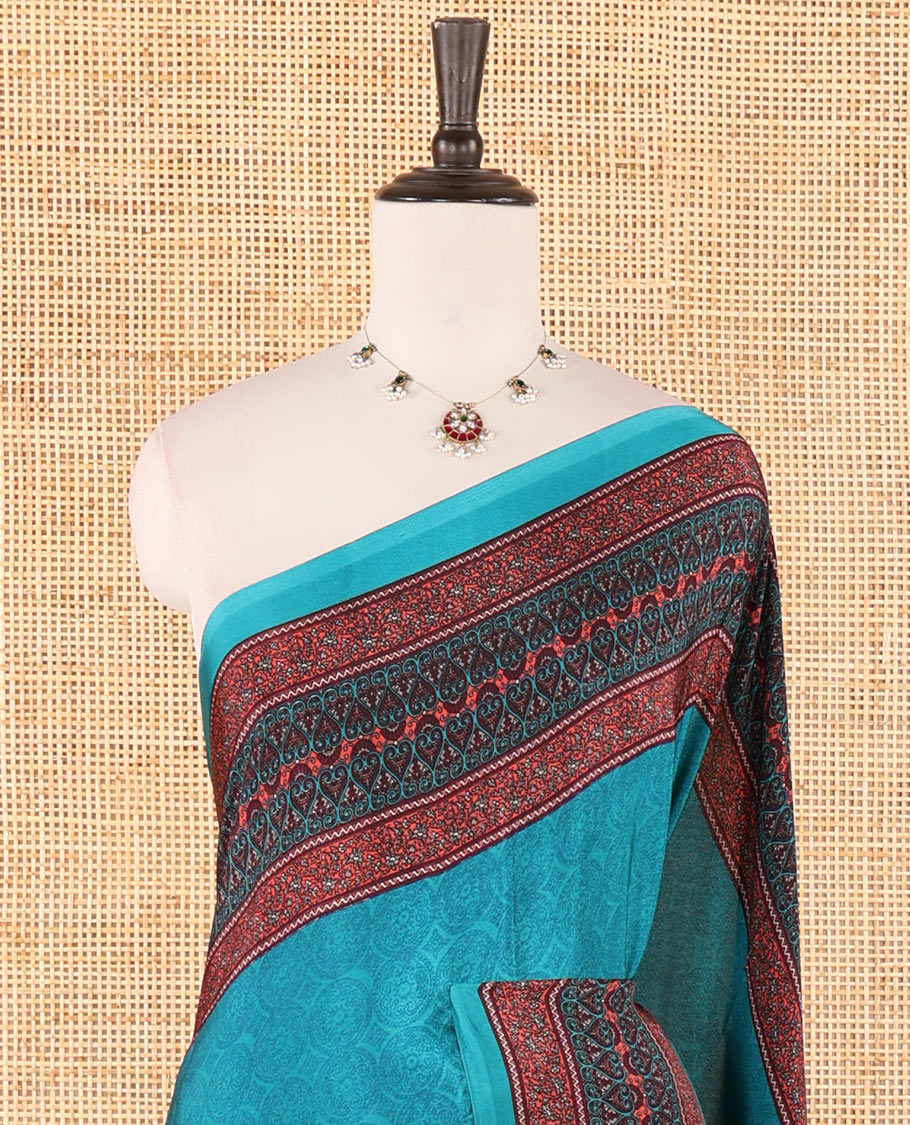 Blue negative-style sparsely printed crepe silk saree, contrast printed border, printed pallu & printed blouse
